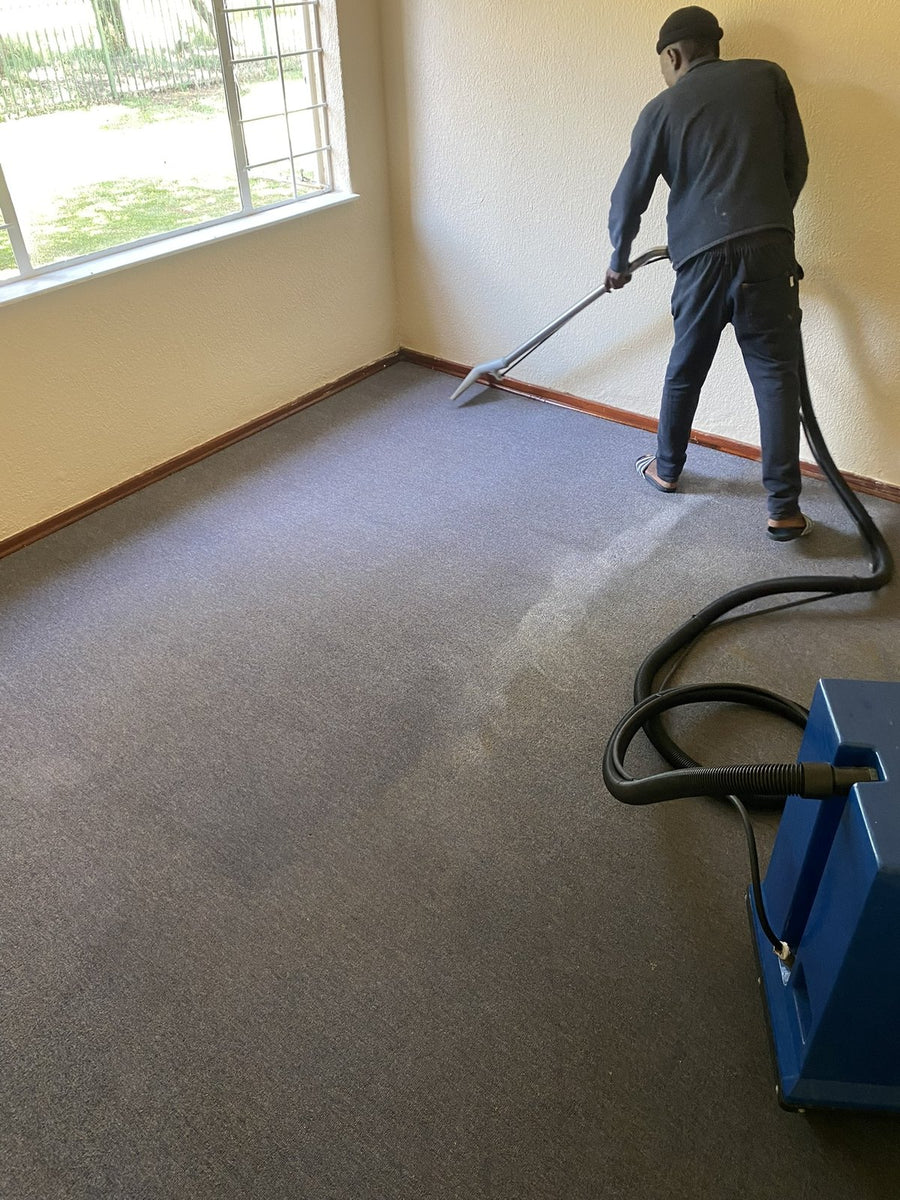 A-Z Chem technician professionally extracting a fitted carpet