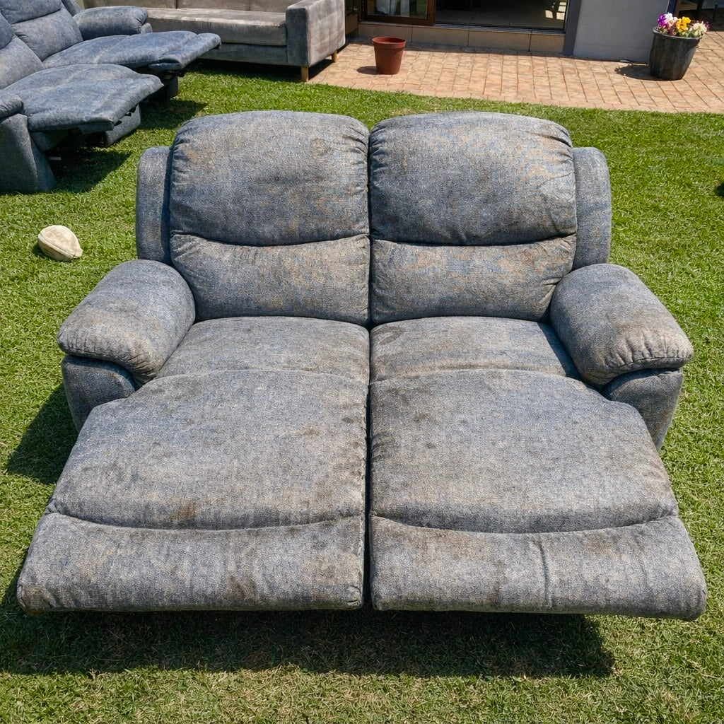 Soiled grey reclining sofa before professional upholstery cleaning by A-Z Chem